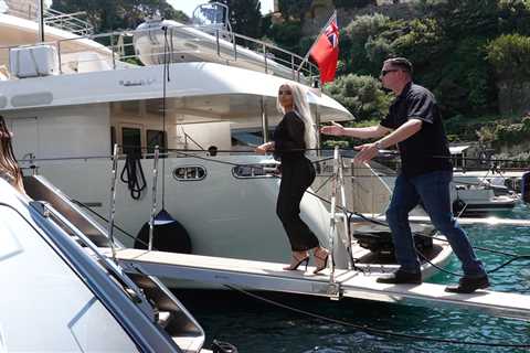 Kim Kardashian stuns in sheer black dress while Kourtney rocks gothic veil during family yacht..