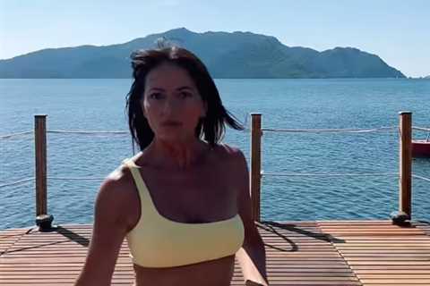Davina McCall, 54, twerks in a yellow bikini as she reveals incredible figure on holiday