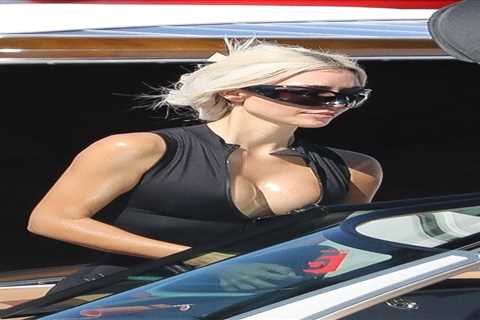 Kim Kardashian spills out of plunging top & shows off real skin with natural wrinkles as fans..