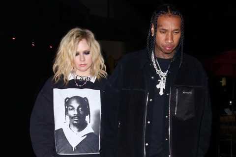 Tyga and Avril Lavigne Attend Kyrie Irving’s Birthday Party in an Ask Yurself Snoop Dogg Sweater..