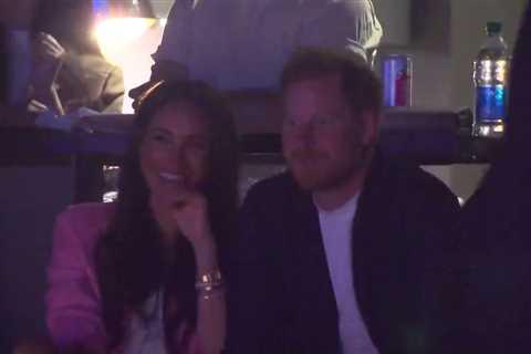 Meghan Markle and Prince Harry giggle and pull faces at Lakers basketball game after coronation snub