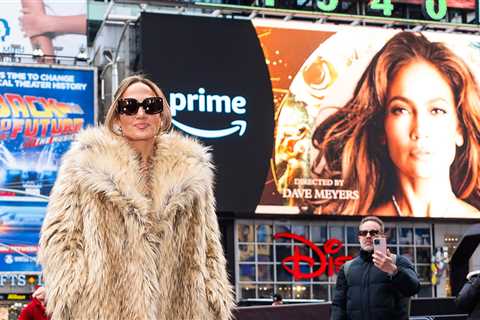 J Lo Poses In Front of Times Square Billboards Promoting Her New Album