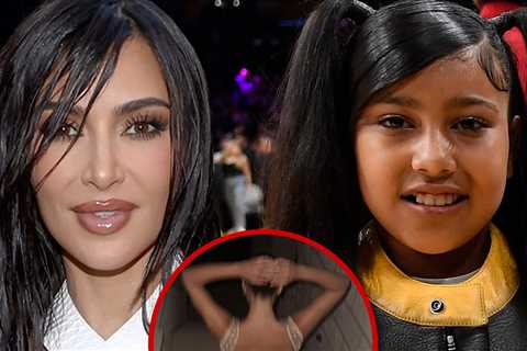 Kim Kardashian Poses in Gold Minidress in Pics Taken by North West