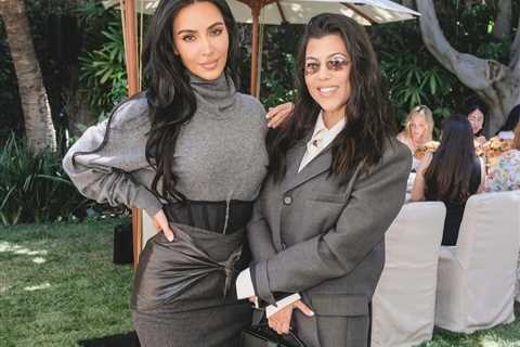 Kim Kardashian Celebrates Law School Graduation in Gray Sweater and a Black Vintage Versace..