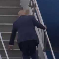 Donald Trump Trips Up The Steps Of Air Force One