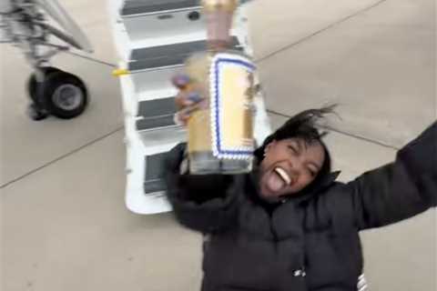 Simone Biles does split with a bottle of tequila after private jet trip for Bears’ Black Friday game