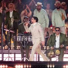 Bad Bunny Slips & Falls During Concert, But His Fans Keep the Show Going for Him