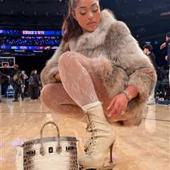 Jordyn Woods Courtside in Fur with an Hermes Himalayan Birkin and Dsquared2 Stiletto Boots