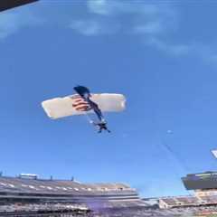 Shocking scene as parachuter caught in field goal netting at bowl game