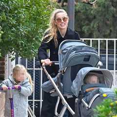 Amber Heard All Smiles as Johnny Depp Films Hollywood Return