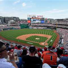Nationals ban fan after holding white nationalist sign