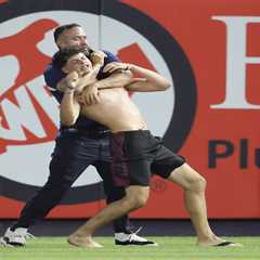Three fans get tackled by security after storming field at Yankees game in wild scene